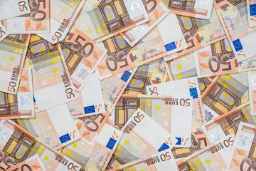 50 new and old euro bills as background