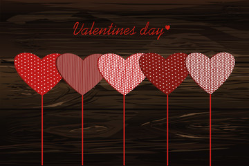 Red hearts on a stick with the image. Valentine's Day. Vector 