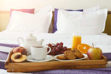 Breakfast served in bed on wooden tray