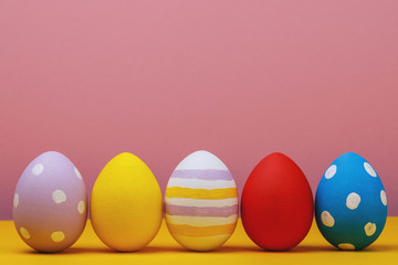 Fototapeta na wymiar Multicolored easter eggs with space for text, close-up