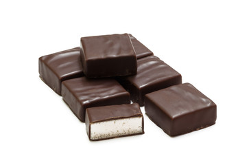 Chocolate candies isolated on white background, bird's milk
