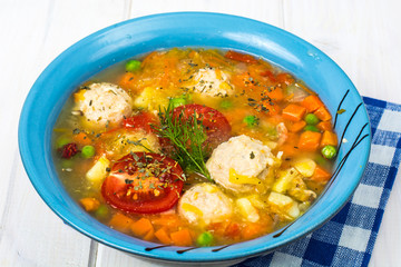 Chicken broth with vegetables and meatballs