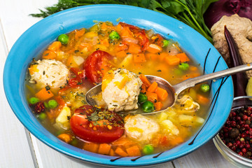 Chicken broth with vegetables and meatballs