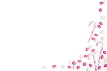 Frame Pink and White candies and lollipops Top view White Background Valentine's Day