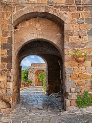 Obraz premium Bolsena, Viterbo, Lazio, Italy: ancient city gate in the old town