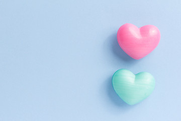 Couple of heart shape over blue table. Romantic Valentine Day concept with copy space