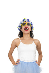 Pretty woman is laughing. Black teenager is dressed for Carnival. Crown and necklace of flowers. Sunglasses. Mardi Gras Concept, Travel, Tourism..