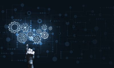 Glowing cogwheel mechanism icon on dark background as symbol of teamwork