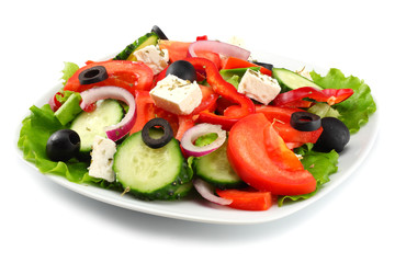 Square plate of greek salad isolated on white. fresh vegetable salad