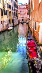Fototapeta na wymiar Small Side Canal Bridge Red Gondola Venice Italy