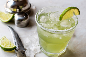 Classic Margarita Cocktail in Salted Glass with Lime and Crushed ice.