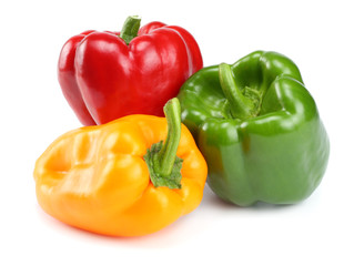 three green, red, yellow sweet bell peppers isolated on white background