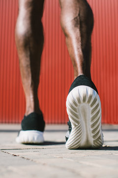 Details of the shoes of a runner.
