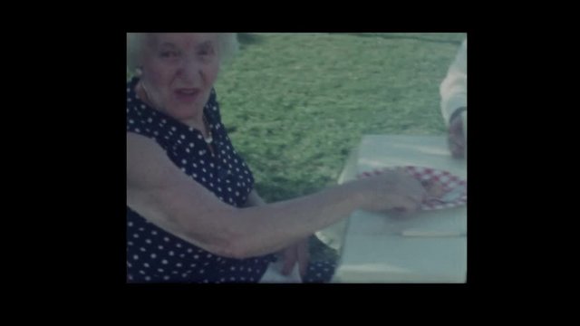 1966 Woman serves lasagna to family
