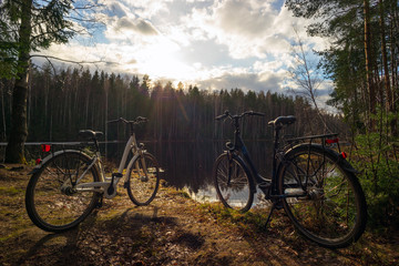 Fototapeta premium Two bikes on the lake in the spring.