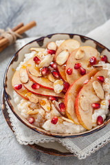 Coconut rice with pomegranate, pear and almond slices