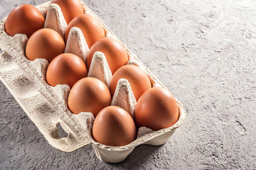Farm raw fresh egg in pack on gray table scrambled eggs omelet fried egg - 187381368