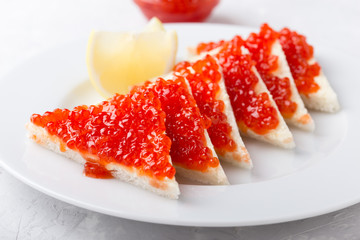 Red salmon caviar served on toast