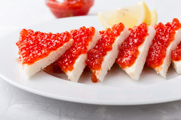 Red salmon caviar served on toast