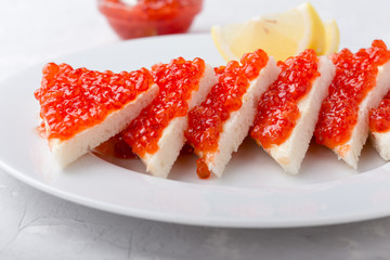 Red salmon caviar served on toast