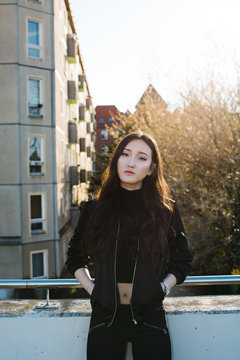 Sunny Outdoor Portrait of Cool Mongolian Girl in Black Bomber Jacket
