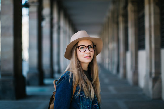 portrait of woman with glasses and hat