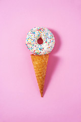 Funny bagel ice-cream on a pink background. Abstract conception. 