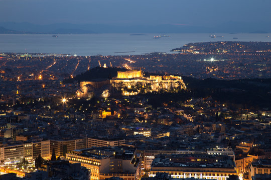 Illuminated Acropolis in Athens, Greece at dusk
