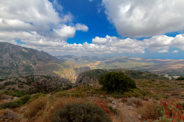 The day landscape shot from the mountain in Greece. Summer and the sunny sky.