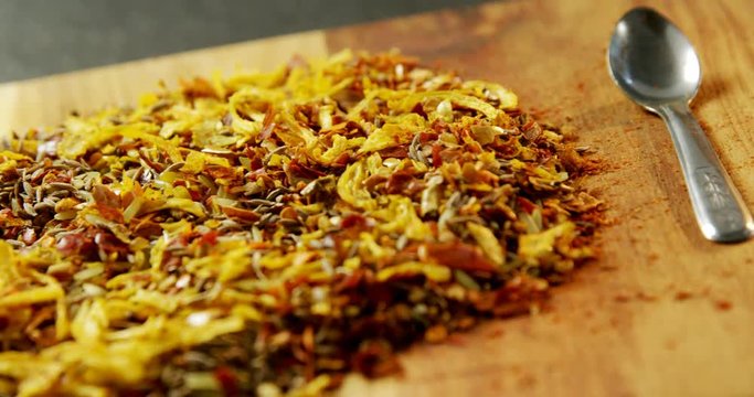 Mix spices with spoon wooden board 