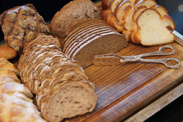Assortment of baked bread on the wooden table