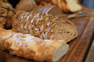 Assortment of baked bread on the wooden table