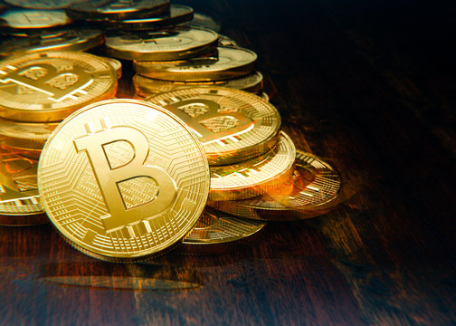 Bitcoin stack, golden coins on table