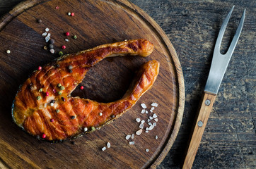 Grilled salmon on cutting board