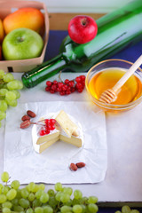 Cheese, camembert, honey, green bottle, red berries, apples, pears, cheese with green grapes, peanuts, pink flower, minimalism, healthy food, French breakfast, pop art, retro style