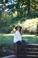 Fototapeta premium Cheerful woman sitting in park