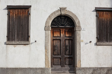 Fototapeta na wymiar Old wooden doors with beautiful metal handles.