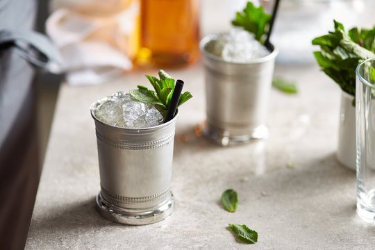 Mint Julep in silver copper tins.