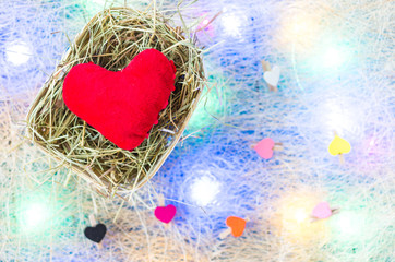 Red heart and many little hearts. Multicolored garland. Flat lay.