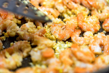Close-up of shrimps fried in a frying pan