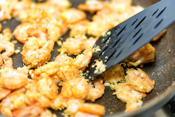 Close-up of shrimps fried in a frying pan