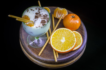 Delicious dessert with fruit and straw biscuits in a glass