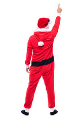 Back view of Young man in santa costume with open hands pointed up isolated white background
