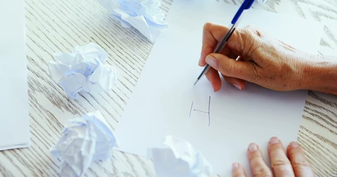 Executive writing on paper 
