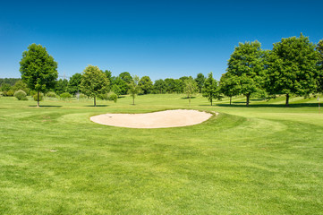 Golf course Landscape green field beautiful blue sky