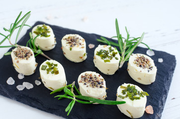 Mini appetizers from soft cheese with spices