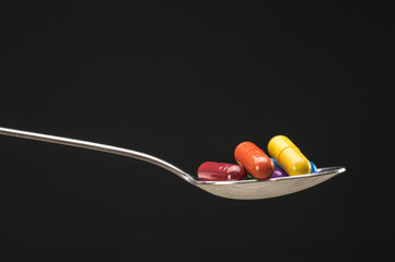 Pills in spoon