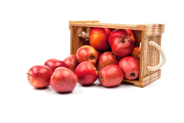 Wooden box with apples isolated on white background