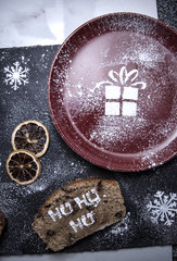 Gift Stencil made of Icing Sugar on a Red Plate