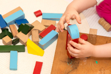 Obraz na płótnie Canvas Child playing with old building blocks